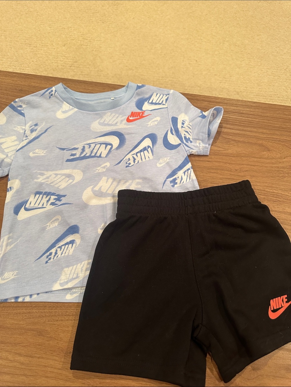 Nike Light Blue Logo Tee with Black Shorts